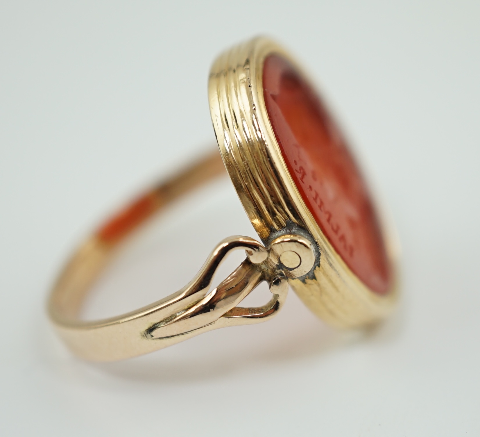 A 19th century gold and intaglio carnelian set oval signet ring